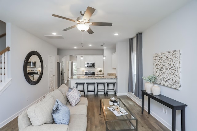2804 Sonoma Way, Columbia, TN 38401 - living area with a ceiling fan, recessed lighting, dark wood-style floors, and arched walkways