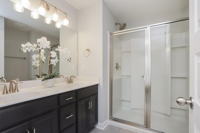 2804 Sonoma Way, Columbia, TN 38401 - bathroom featuring a stall shower, tile patterned floors, double vanity, and a sink