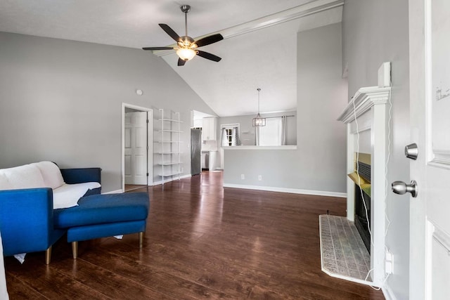 5000 Trailwater Dr, Antioch, TN 37013 - sitting room featuring a fireplace with raised hearth, a ceiling fan, dark wood-style floors, baseboards, and high vaulted ceiling