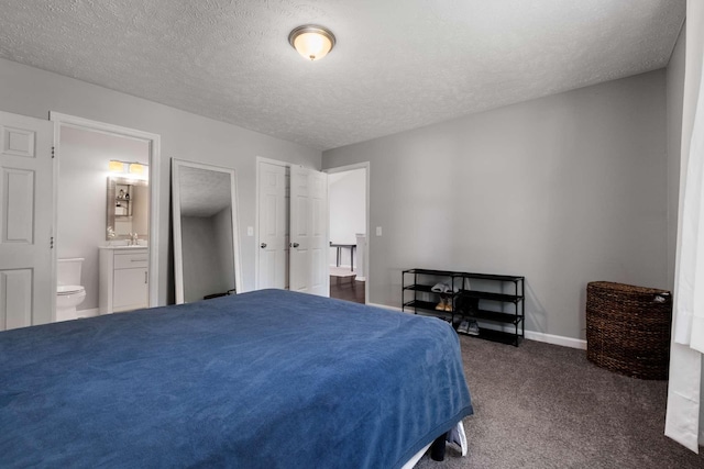 5000 Trailwater Dr, Antioch, TN 37013 - bedroom with ensuite bathroom, carpet floors, a textured ceiling, baseboards, and a sink