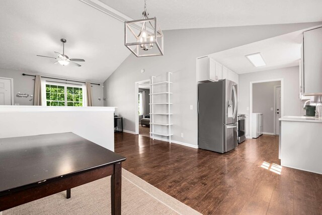 5000 Trailwater Dr, Antioch, TN 37013 - unfurnished dining area featuring lofted ceiling, dark wood-style floors, washer / clothes dryer, ceiling fan, and a chandelier