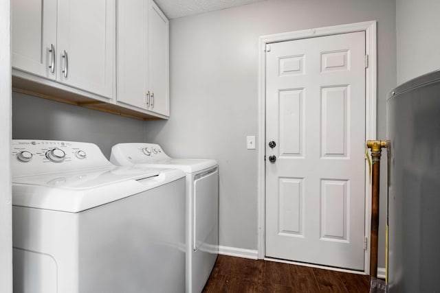 5000 Trailwater Dr, Antioch, TN 37013 - clothes washing area with washing machine and dryer, cabinet space, dark wood finished floors, and baseboards