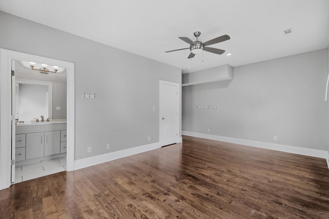 2221 10th Ave S, Nashville, TN 37204 - spare room with ceiling fan, wood finished floors, a chandelier, baseboards, and a sink