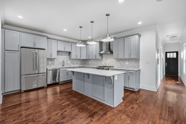 2221 10th Ave S, Nashville, TN 37204 - kitchen with stainless steel appliances, wall chimney range hood, gray cabinets, backsplash, and ornamental molding