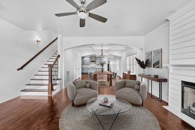 2221 10th Ave S, Nashville, TN 37204 - living room with arched walkways, stairs, wood finished floors, ceiling fan, and baseboards