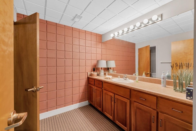 bathroom featuring vanity and a paneled ceiling