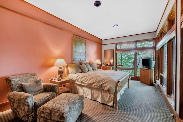 carpeted bedroom featuring recessed lighting and crown molding