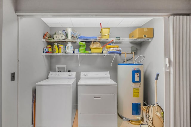 laundry area with water heater, laundry area, and independent washer and dryer