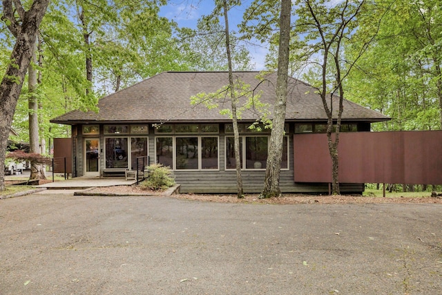 view of front of property with roof with shingles