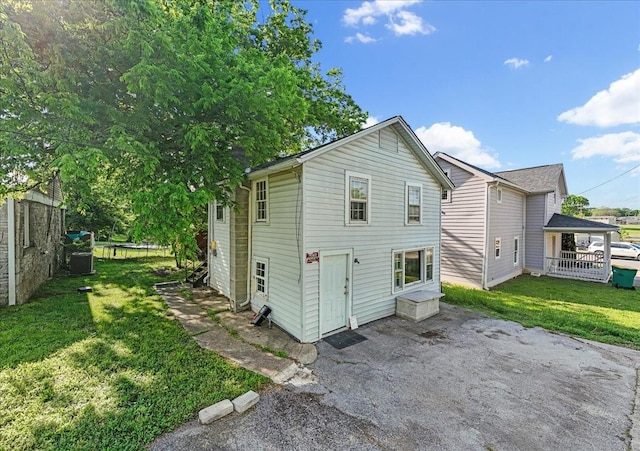 108 7th Ave S, Lewisburg, TN 37091 - rear view of house featuring a patio, fence, and a lawn