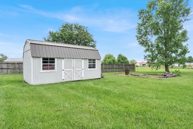 view of shed featuring fence