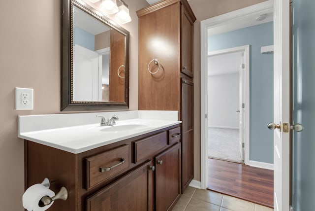 bathroom with tile patterned flooring and vanity
