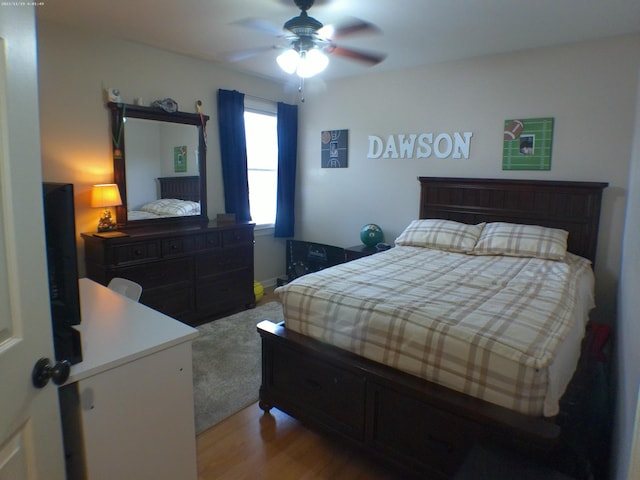 bedroom featuring a ceiling fan and light wood-type flooring