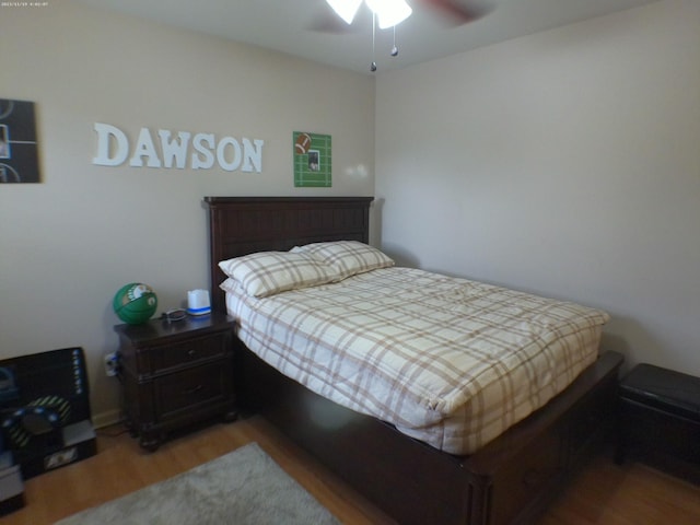 bedroom featuring a ceiling fan and wood finished floors
