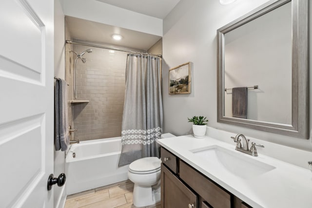 full bath featuring shower / bath combination with curtain, toilet, and vanity