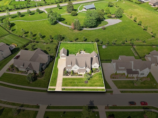 birds eye view of property with a residential view