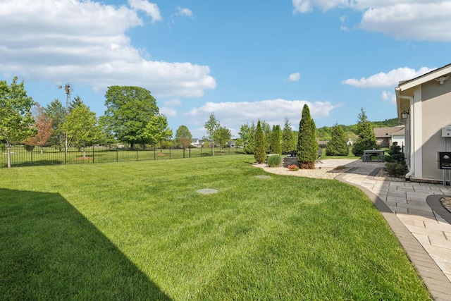 view of yard featuring a patio area and fence
