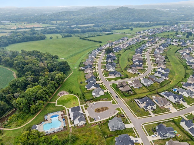 birds eye view of property with a residential view