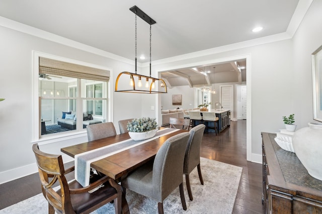 dining room featuring a notable chandelier, recessed lighting, baseboards, ornamental molding, and dark wood finished floors
