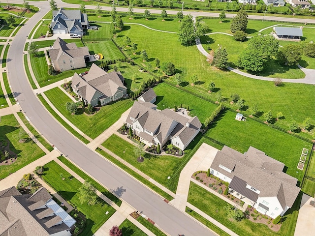 birds eye view of property with a residential view