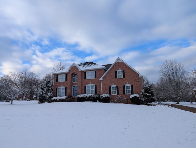 view of front of home featuring brick siding