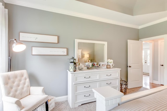 bedroom with crown molding, light carpet, and baseboards