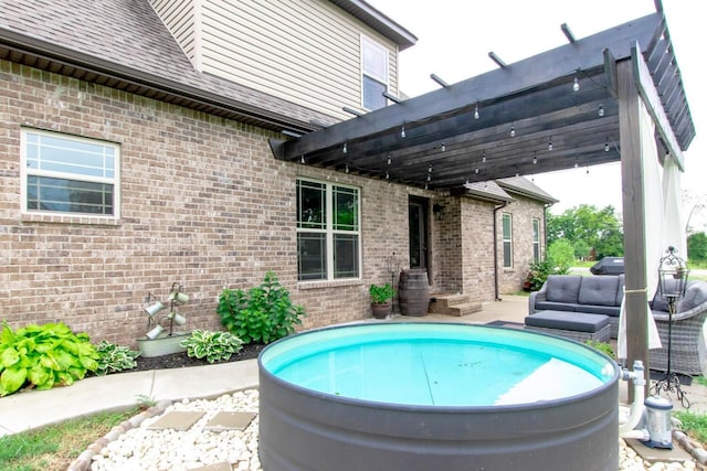 view of pool with outdoor lounge area and a pergola