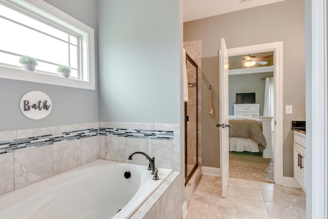 bathroom with a garden tub, ensuite bathroom, baseboards, a shower stall, and ceiling fan
