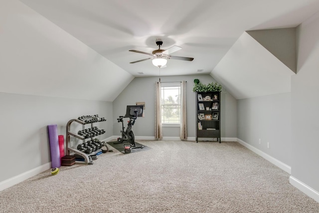 exercise room featuring carpet flooring, a ceiling fan, baseboards, and lofted ceiling