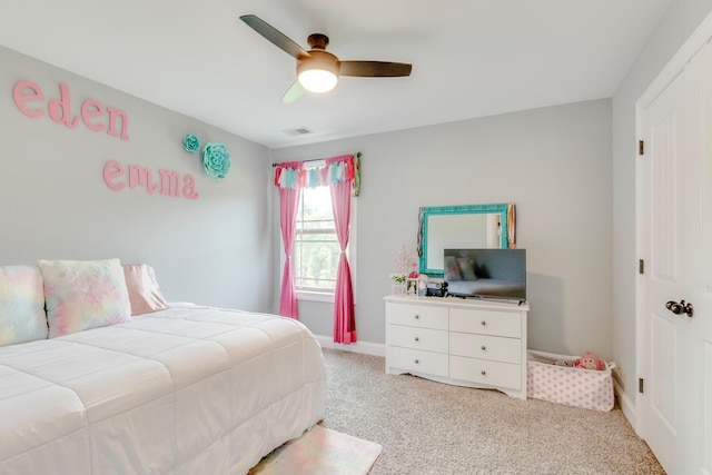 bedroom featuring light colored carpet, baseboards, ceiling fan, and visible vents