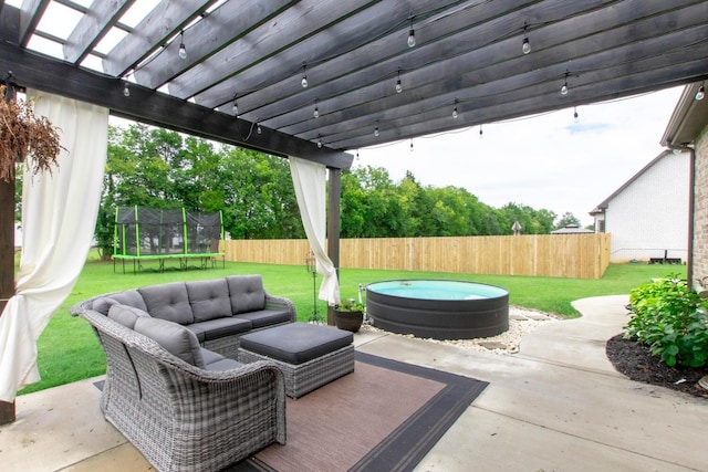 view of patio / terrace with a trampoline, a pergola, outdoor lounge area, and a fenced backyard