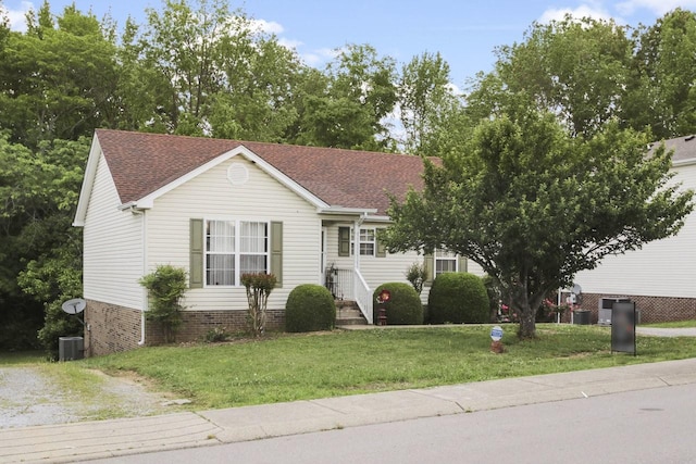 119 Sleepy Hollow Dr, Springfield, TN 37172 - view of front of house with a front yard, roof with shingles, and central AC