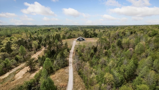 bird's eye view with a rural view and a wooded view