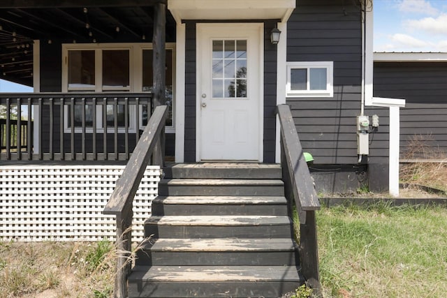 entrance to property with covered porch