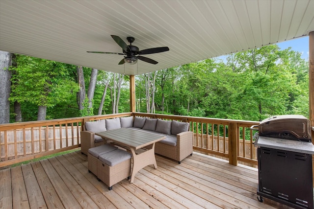 deck featuring a ceiling fan and an outdoor living space