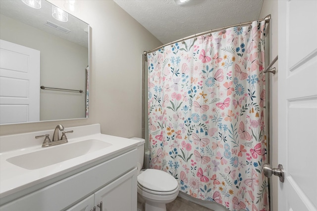 full bathroom featuring a textured ceiling, toilet, vanity, and a shower with shower curtain