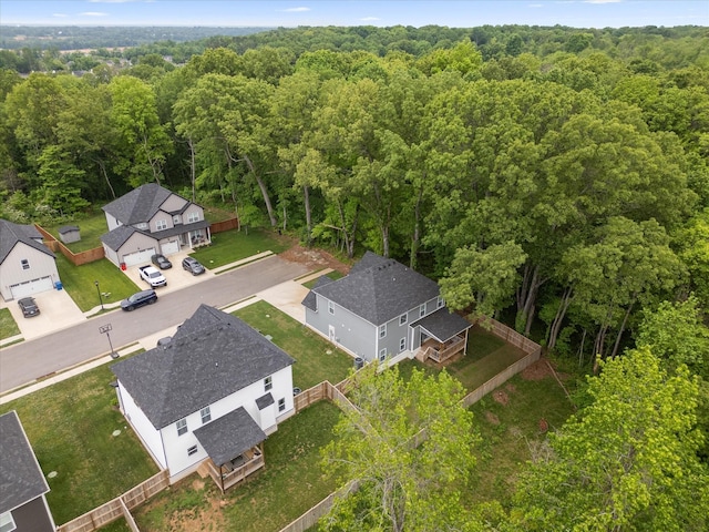 aerial perspective of suburban area with a forest