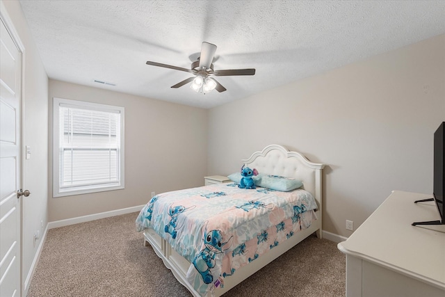 carpeted bedroom with baseboards, a ceiling fan, and a textured ceiling