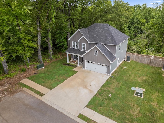 view from above of property featuring a heavily wooded area