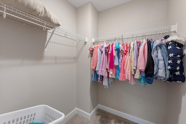 spacious closet with carpet flooring