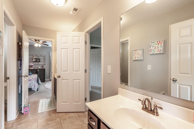 bathroom with a ceiling fan, tile patterned flooring, vanity, and visible vents