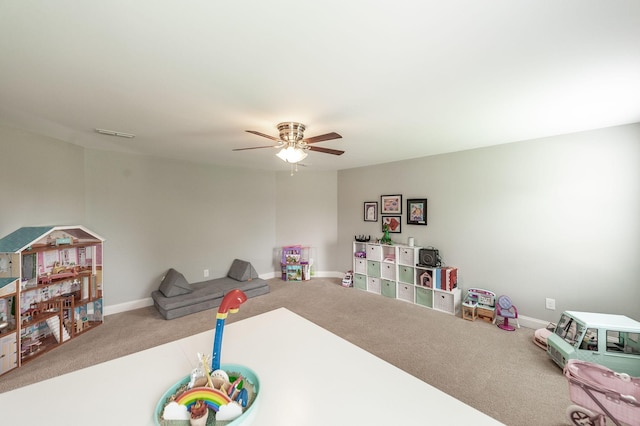 rec room featuring a ceiling fan, carpet flooring, visible vents, and baseboards