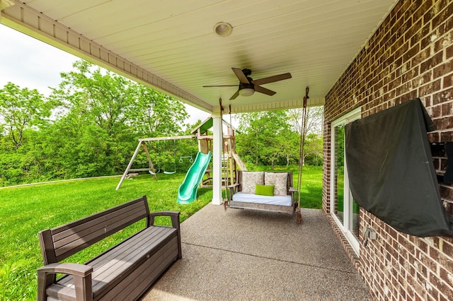 view of patio / terrace featuring ceiling fan and a playground