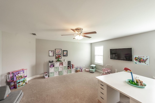 playroom featuring carpet, visible vents, baseboards, and ceiling fan