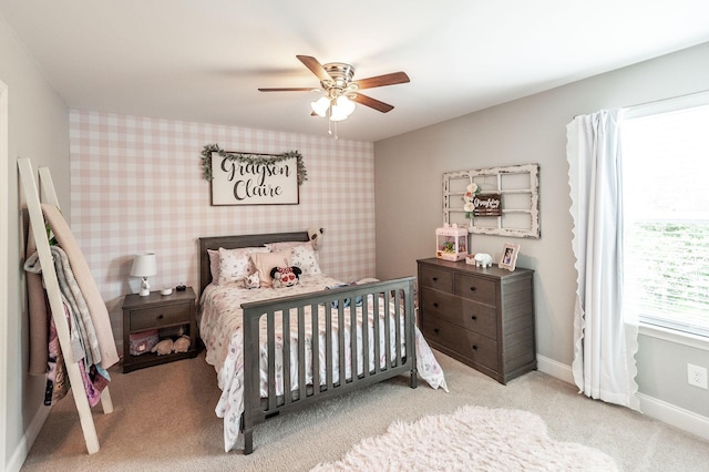 carpeted bedroom with baseboards and ceiling fan