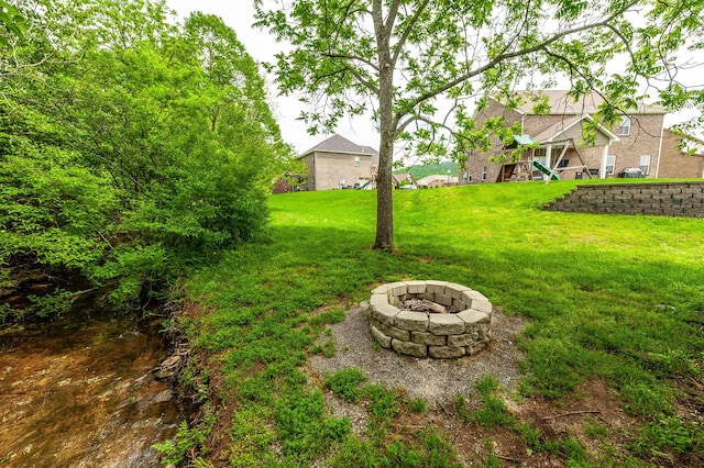 view of yard featuring a fire pit
