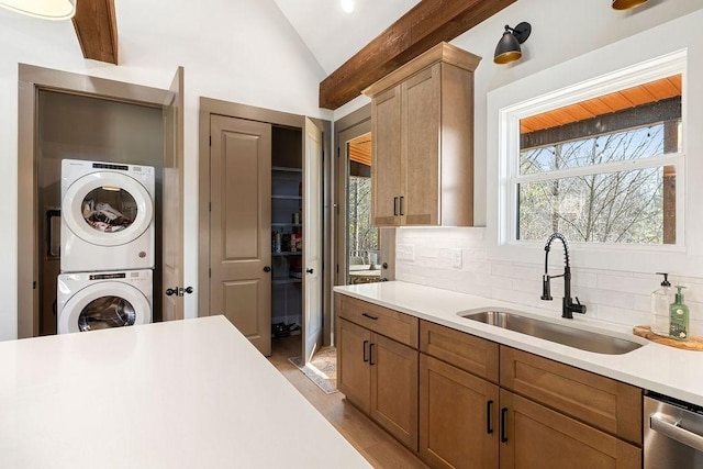 48 Hasty Hill Rd, Lynchburg, TN 37352 - interior space featuring dishwasher, a sink, stacked washer and dryer, vaulted ceiling, and light countertops