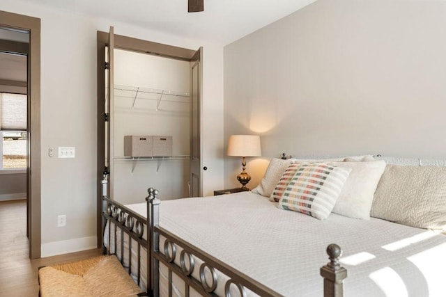 48 Hasty Hill Rd, Lynchburg, TN 37352 - bedroom featuring a closet, baseboards, a ceiling fan, and wood finished floors