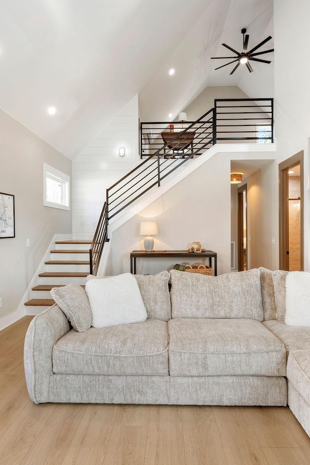 48 Hasty Hill Rd, Lynchburg, TN 37352 - living room with wood finished floors, high vaulted ceiling, stairway, ceiling fan, and recessed lighting
