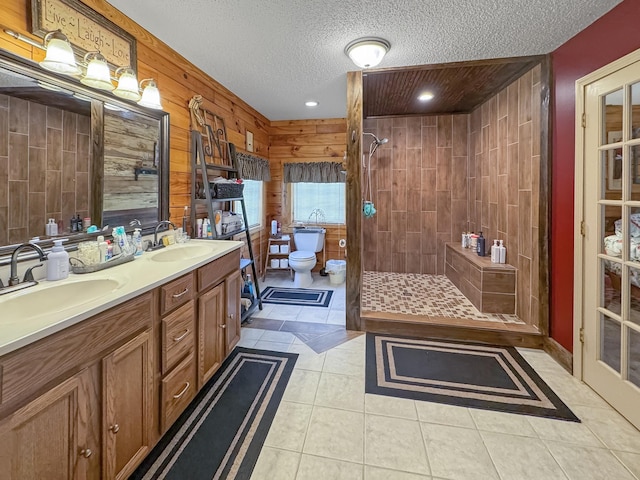 130 Wayne Threatt Rd, Dover, TN 37058 - full bath with a tile shower, wood walls, toilet, and a sink